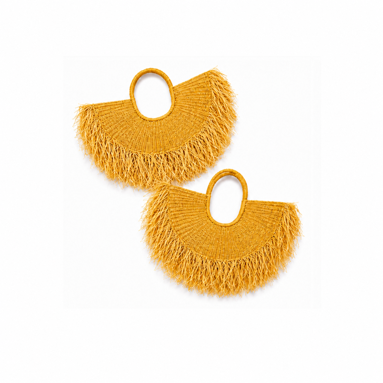 A pair of mustard yellow woven fringe shoulder bags with oval cutouts, displayed on a clean white background.
