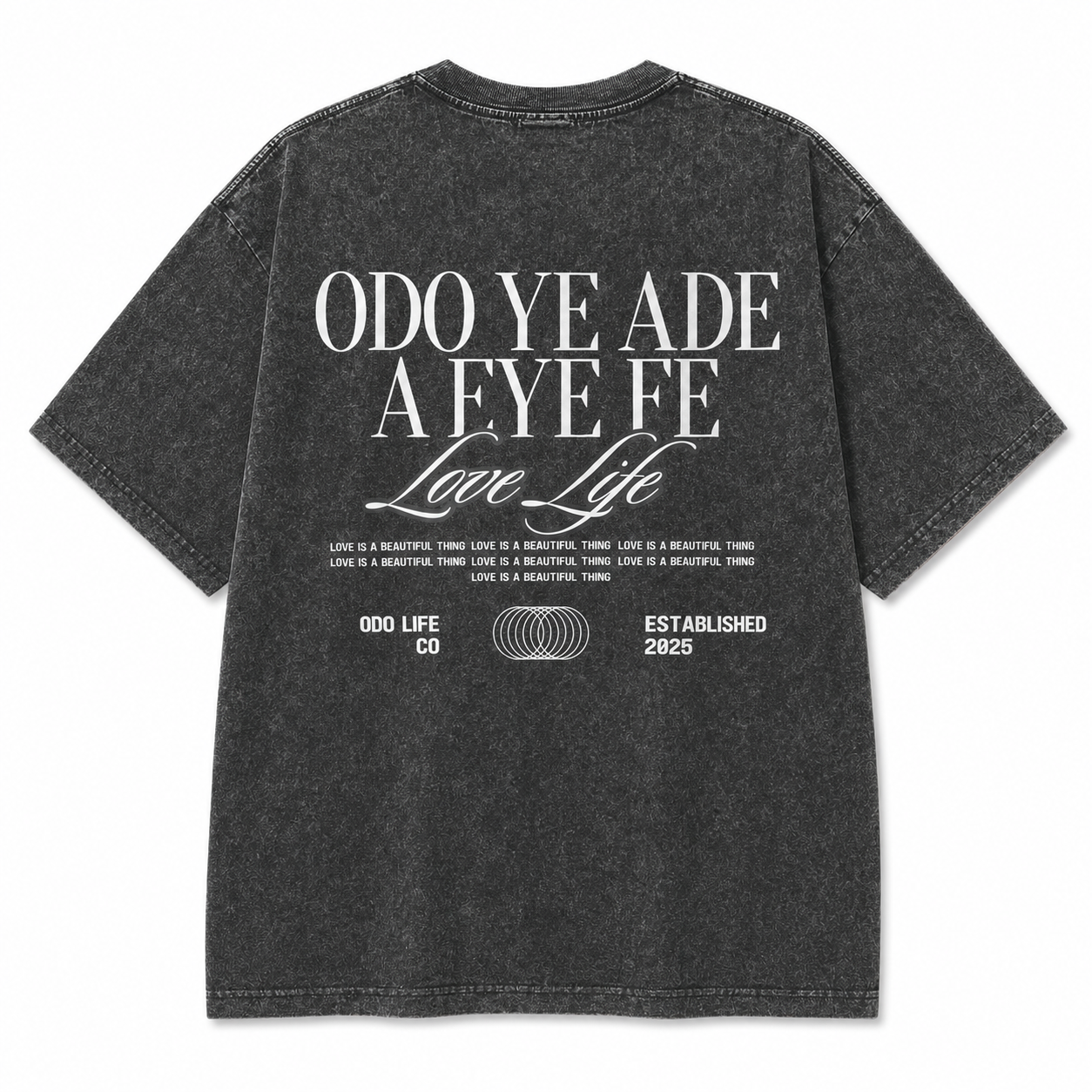 A dark gray mineral-wash t-shirt shown from the back, featuring a large white graphic print with the text 'ODO YE ADE A EYE FE Love Life' and smaller text below.
