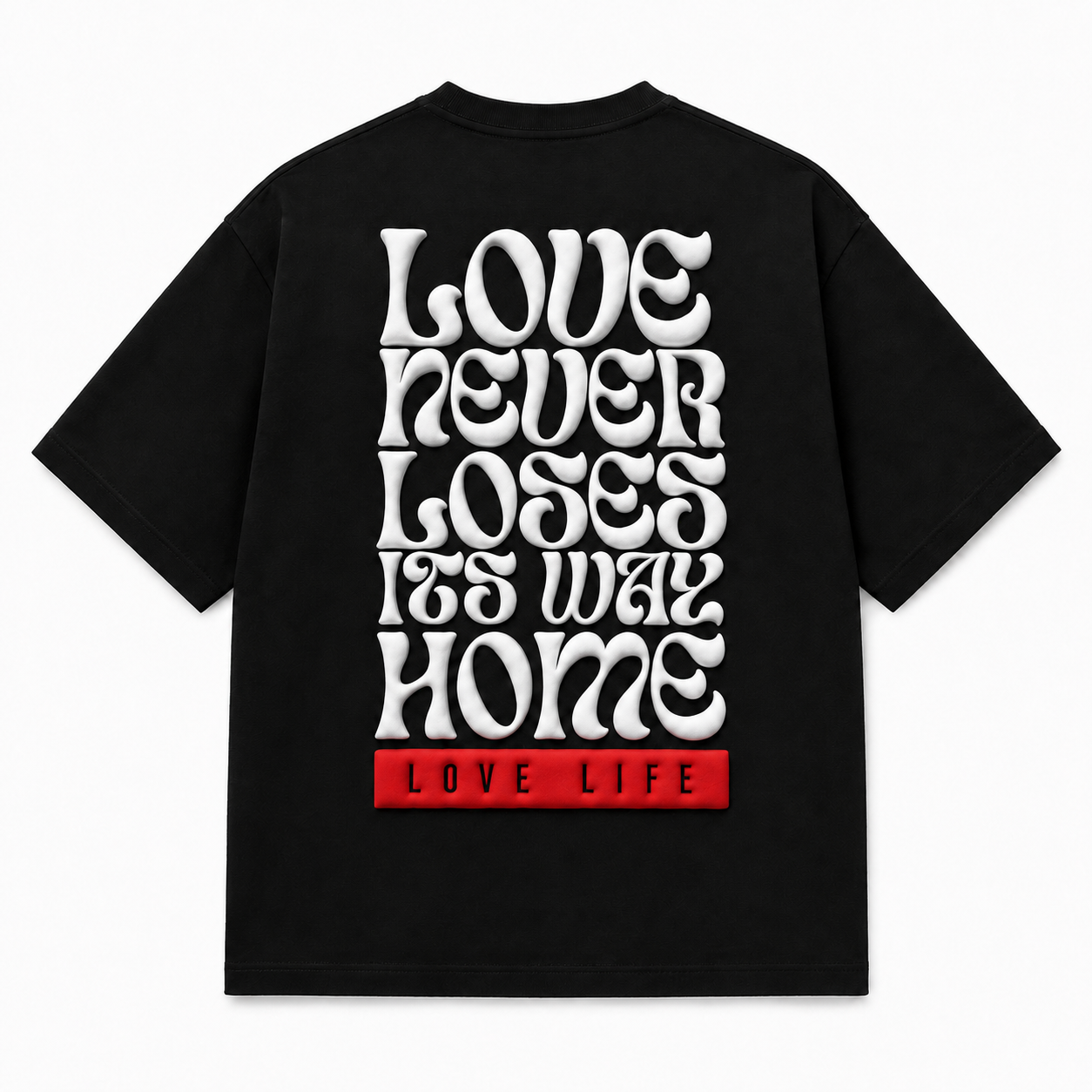 A black short-sleeve t-shirt shown from the back, featuring a large white retro-style text graphic that reads 'LOVE NEVER LOSES ITS WAY HOME' with a red block at the bottom containing the words 'LOVE LIFE'.