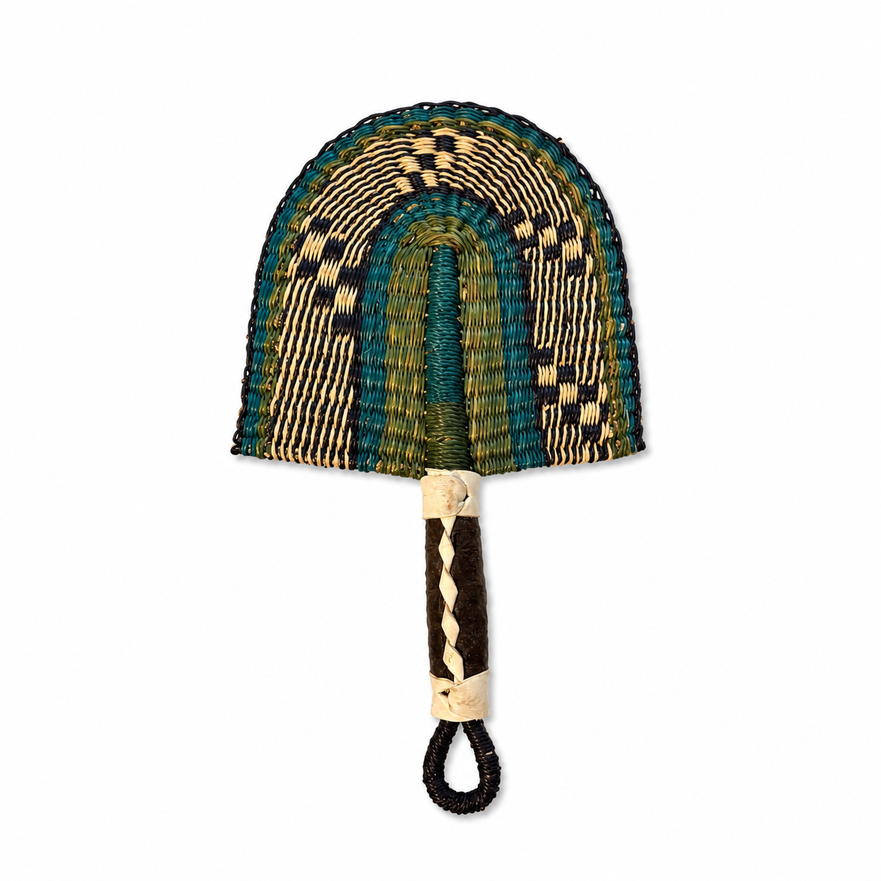A hand-woven fan with a semi-circular woven head in green, teal, beige, and black patterns, and a dark brown wrapped handle with a cream-colored loop.