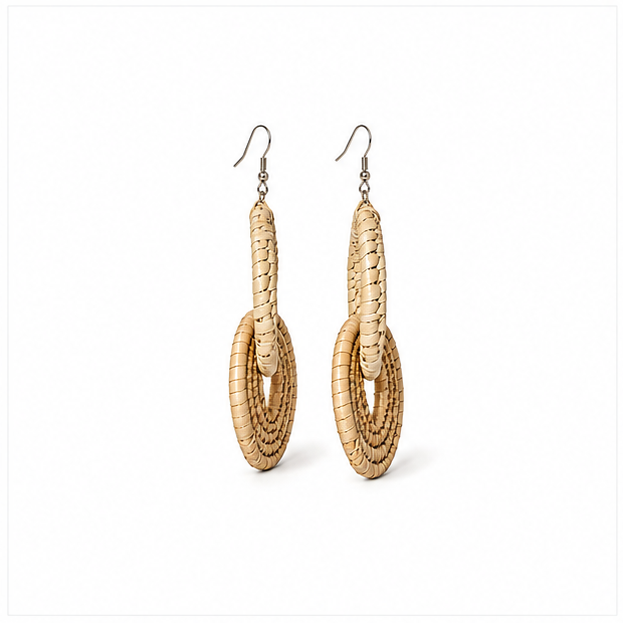 A pair of natural woven straw dangle earrings with silver-tone fishhook wires, displayed against a clean white background.