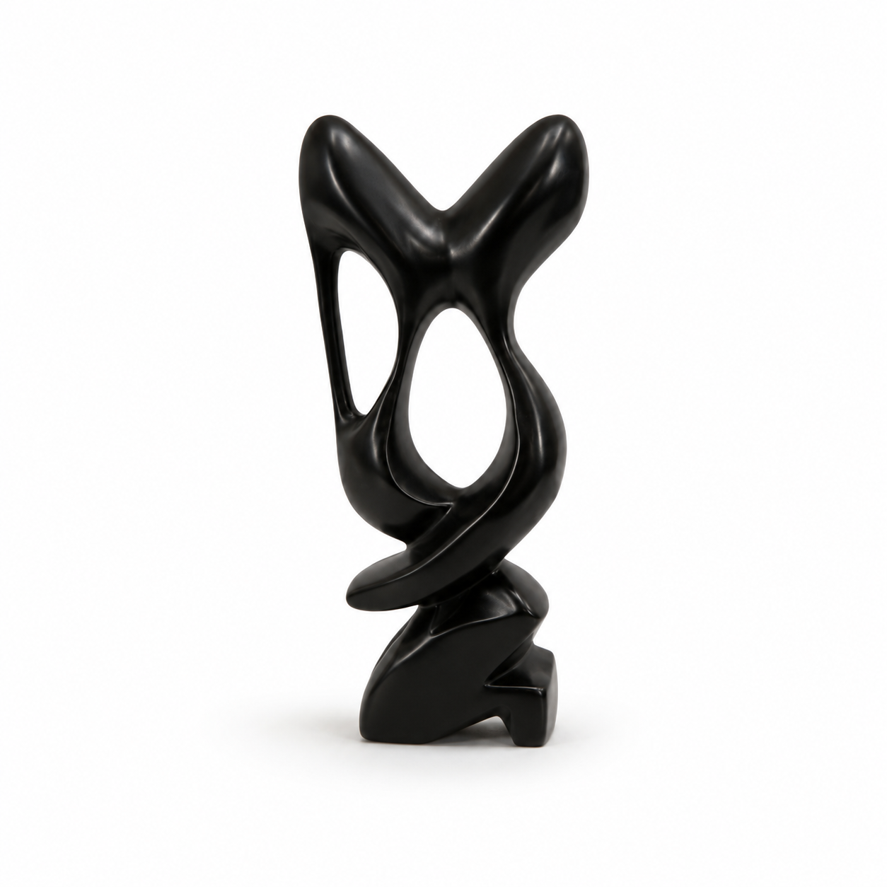 A modern abstract black sculpture with a glossy finish, featuring organic flowing shapes and hollow cutouts, standing on a small sculptural base against a plain white background.