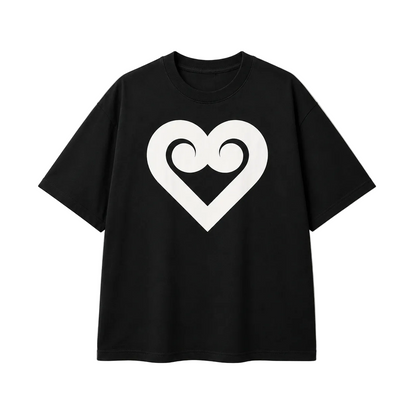 A black short-sleeve crewneck t-shirt featuring a large white heart outline graphic on the chest with a stylized swirl design inside, displayed against a light beige background.