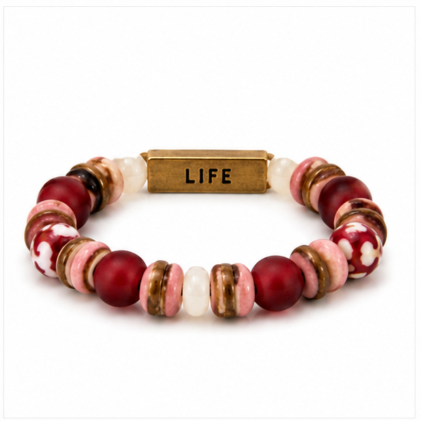A beaded stretch bracelet featuring round and flat disc beads in deep red, pink, white, and brown, with a central rectangular gold-tone metal clasp engraved with the word 'LIFE'.