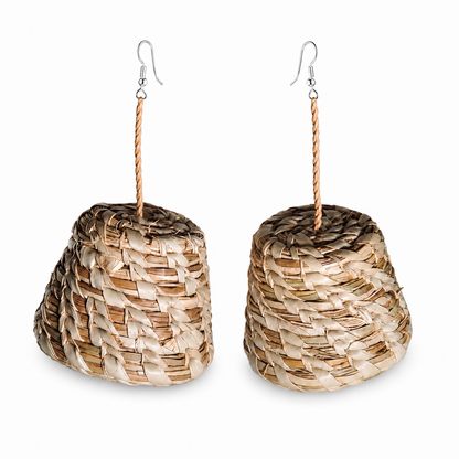 A pair of handmade raffia cone earrings with silver fishhook wires, displayed on a clean white background.