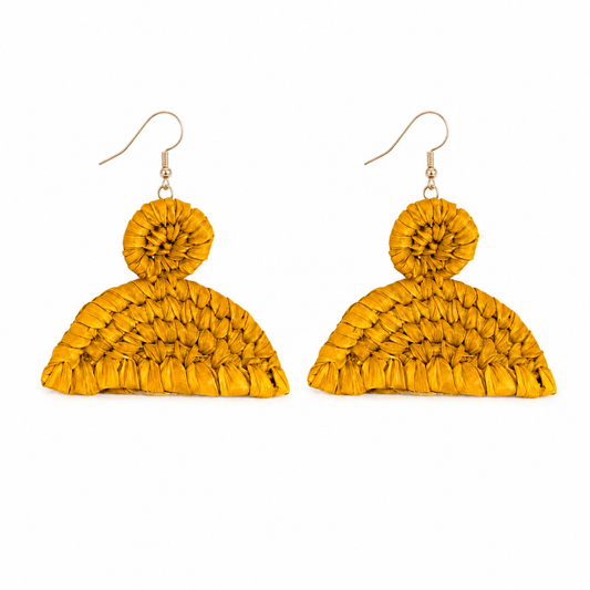 A pair of handmade raffia yellow woven dangle earrings with a textured scalloped fan shape and a small round woven accent at the top, hanging from gold fishhook wires on a white background.